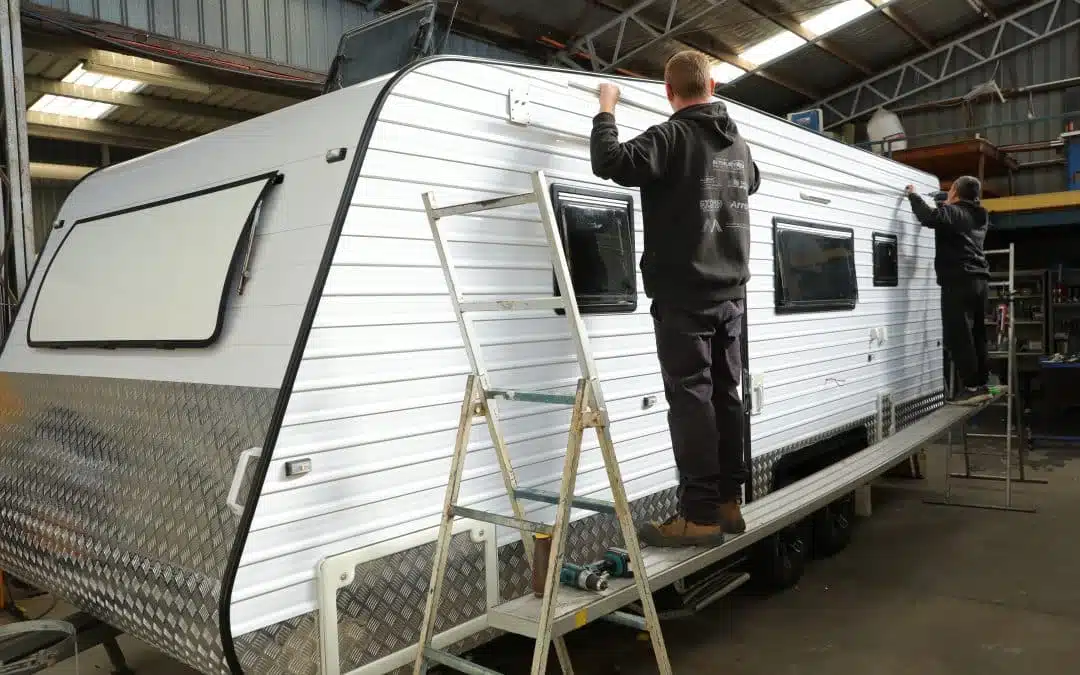 two men repairing van