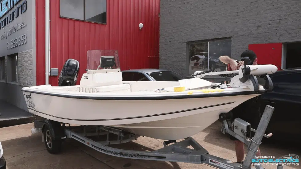 man fixing boat