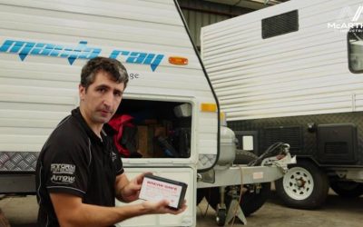 man checking on van brakes