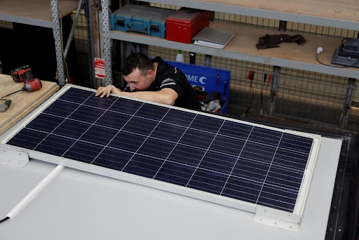 man fixing solar panel man fixing solar panel