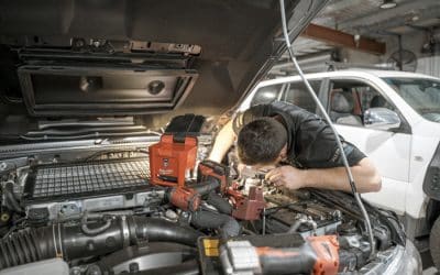 man checking front engine