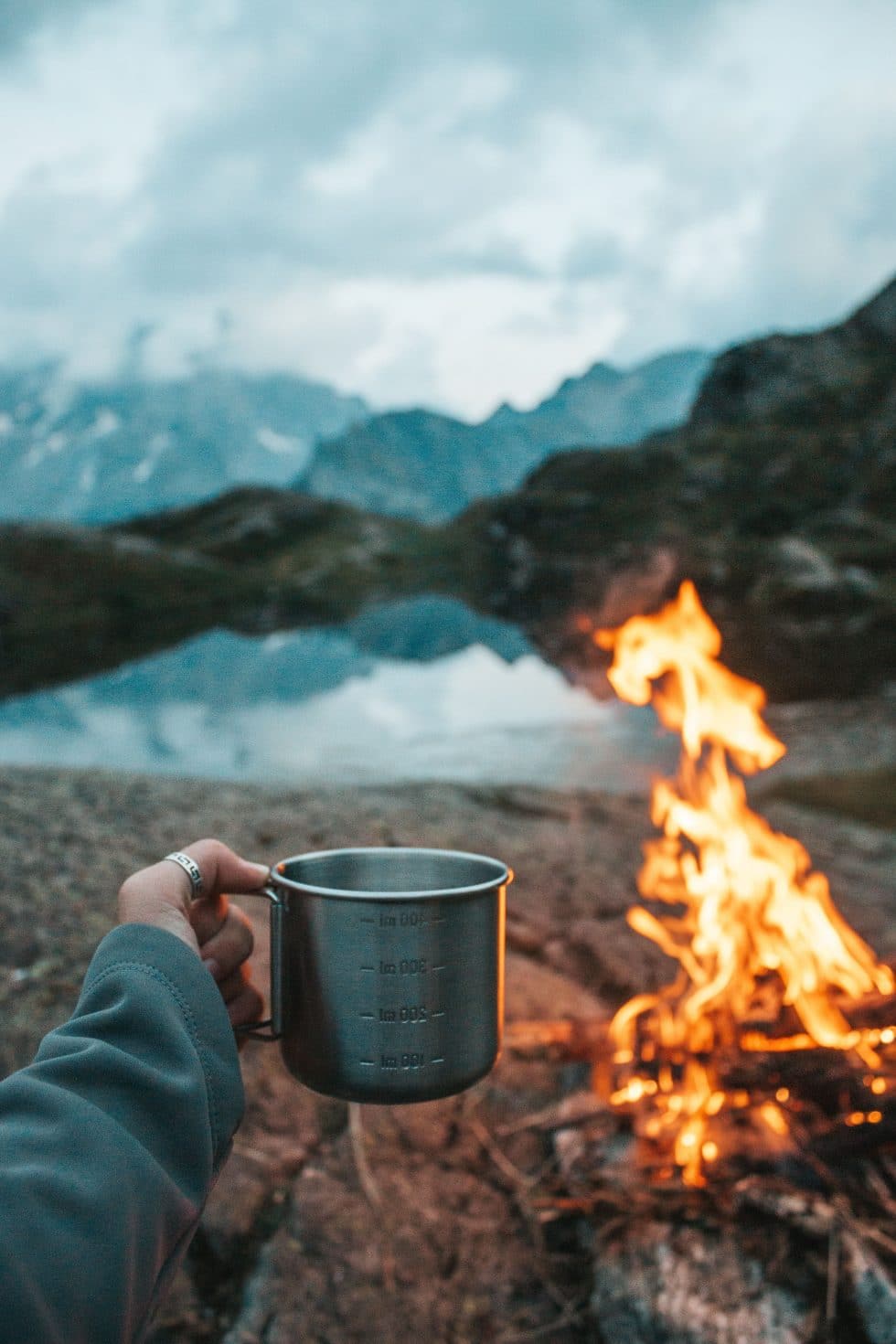 woman holding cup on a camping woman holding cup on a camping