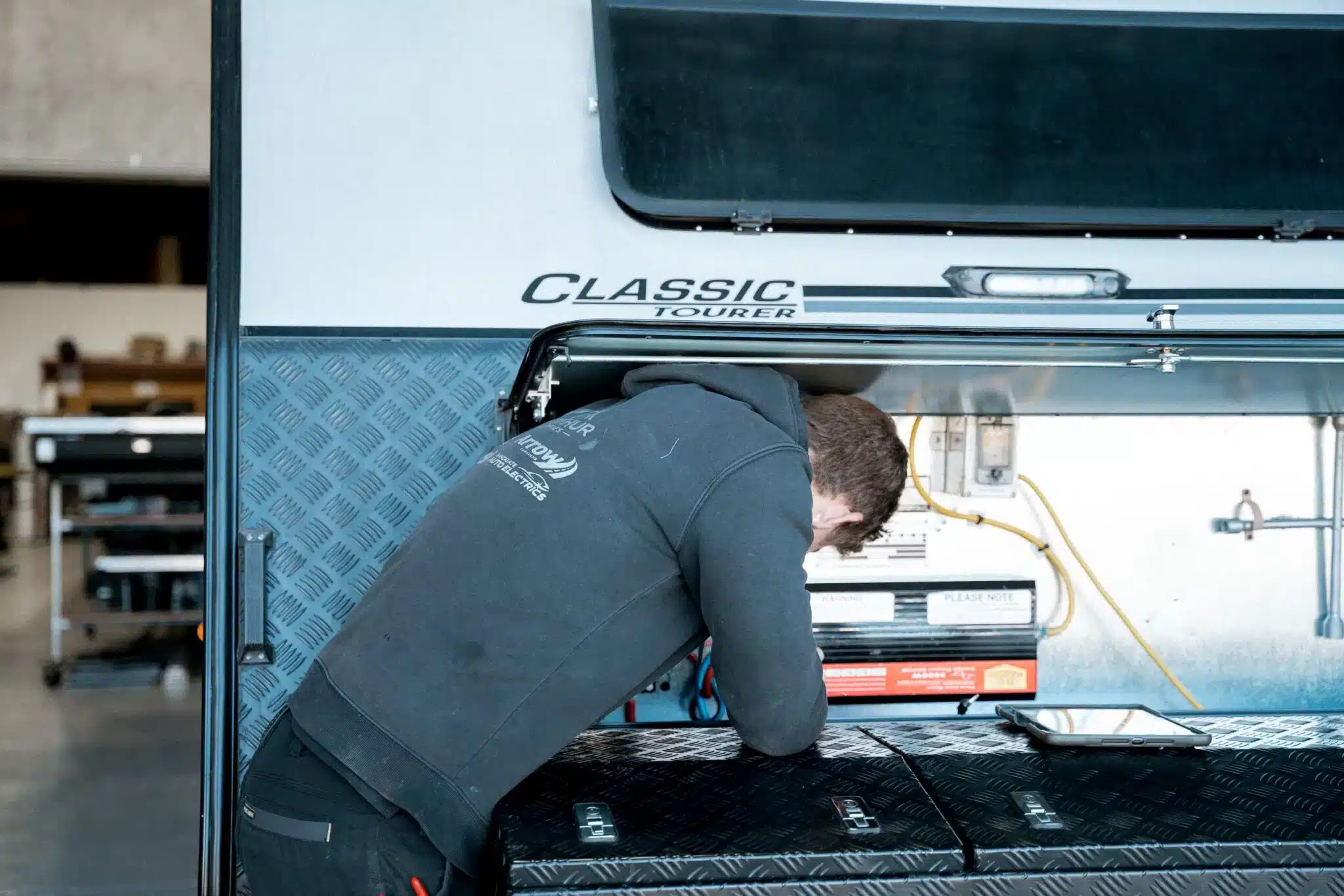Technician servicing a caravan for a smooth journey
