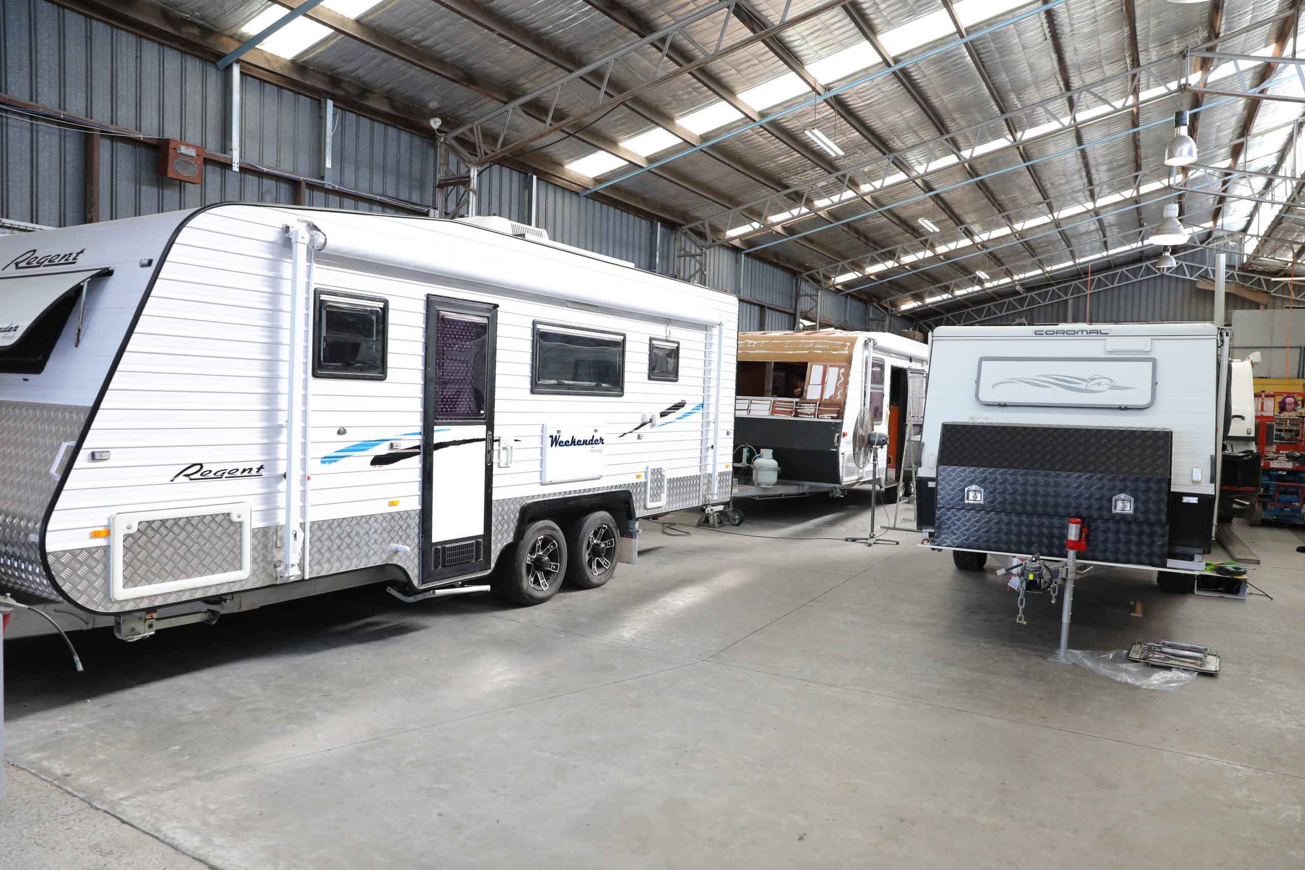 Caravan undergoing interior renovation inside a workshop