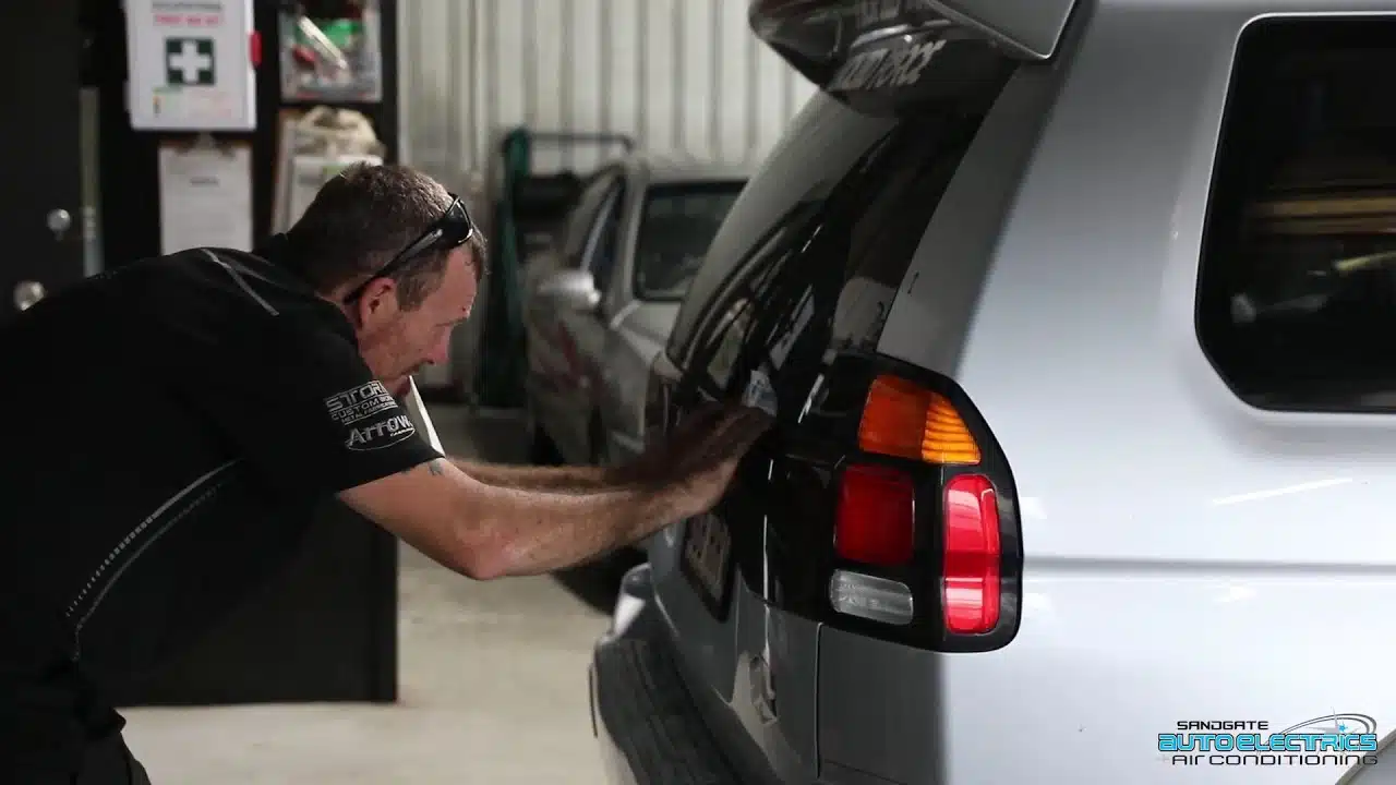 sandgate auto electronics man repairing car